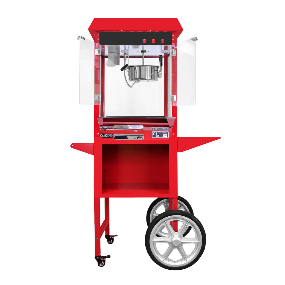 Roter KuKoo Popcornmaschinenwagen mit transparenten Seiten, großen Rädern und einer glänzenden Popcornmaschine, ideal für Veranstaltungen und Partys