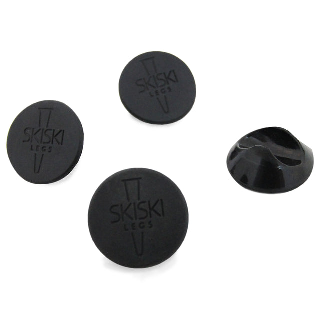 Schwarze Haarnadelbein-Schoner im 4er-Set, 12 mm Durchmesser, aus flexiblem Gummi mit rutschfester Oberfläche und eingeprägtem Logo
